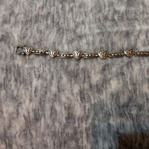 Vintage silver tone (with hearts) link bracelet with magnetic closure.